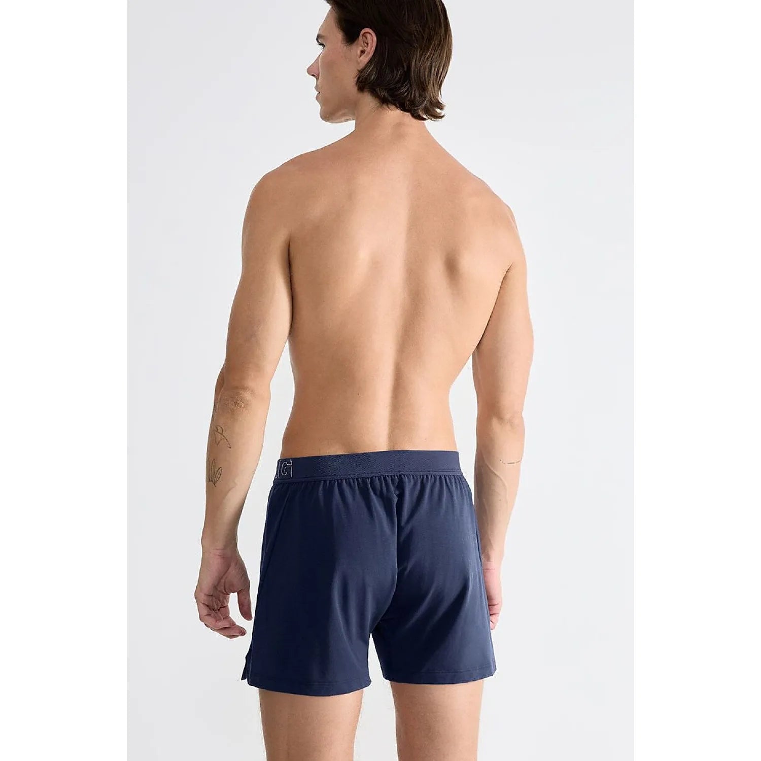 Boxer homme bleu marine Sloggi en coton bio, coupe moderne, confort respirant, vue de dos sur mannequin.