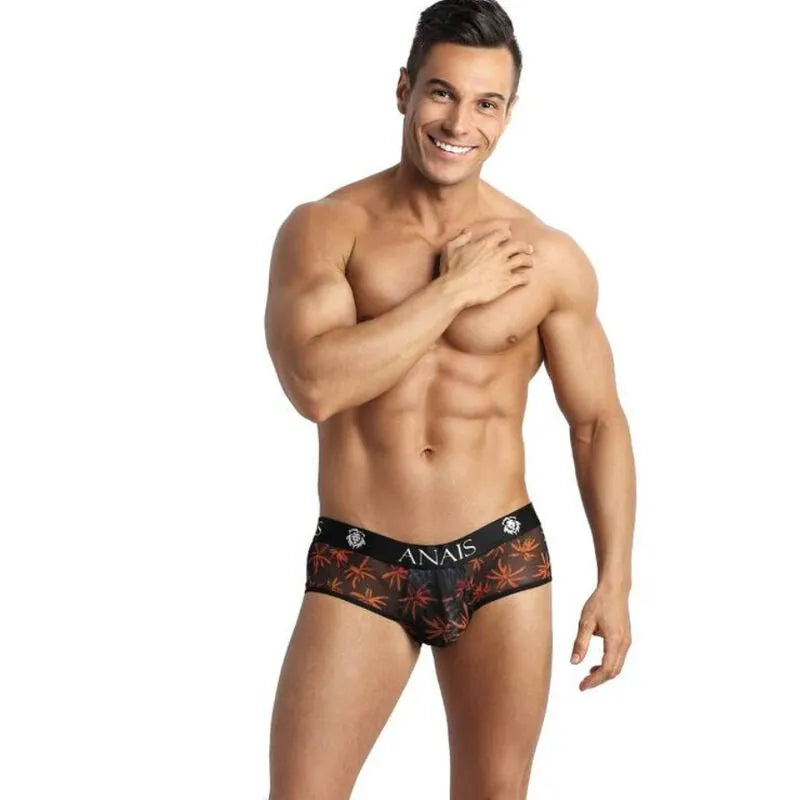 Slip bikini homme noir avec imprimé palmiers colorés, coupe audacieuse révélant les fesses, tissu tulle doux.