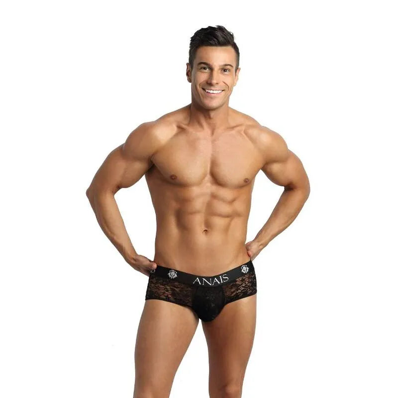 Bikini jock homme en dentelle noire à imprimé fleuri, fesses ouvertes, polyester et lycra, coupe audacieuse.