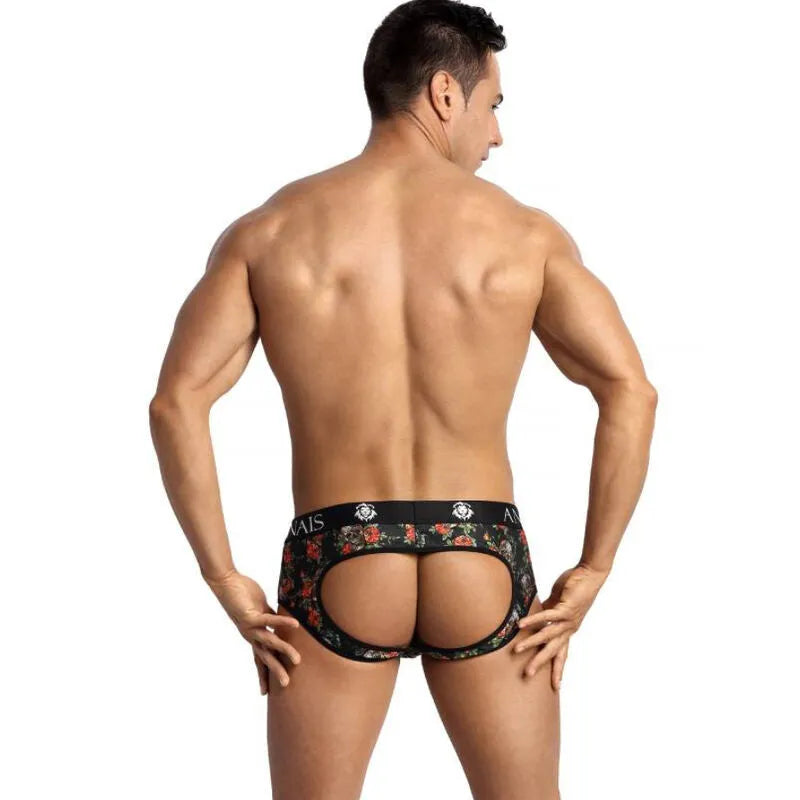 Homme portant un bikini ouvert à motifs roses et têtes de mort, révélant les fesses, Anais Men, lingerie audacieuse.