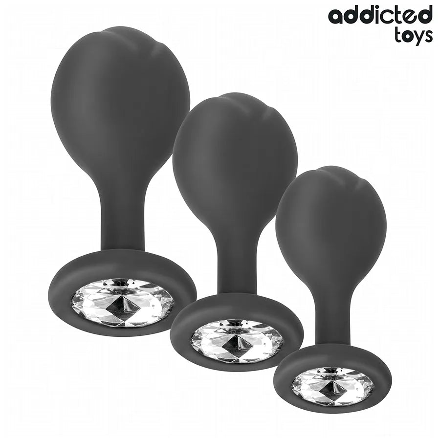 Lot de 3 plugs anaux noirs en silicone avec bijou, tailles progressives, marque Addicted Toys, pour confort et sécurité.