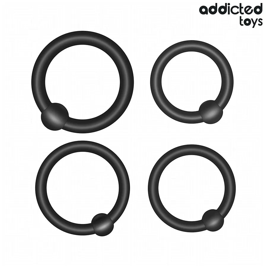 Anneaux de pression en silicone noir Addicted Toys, quatre tailles pour stimulation et contrôle fermeté.