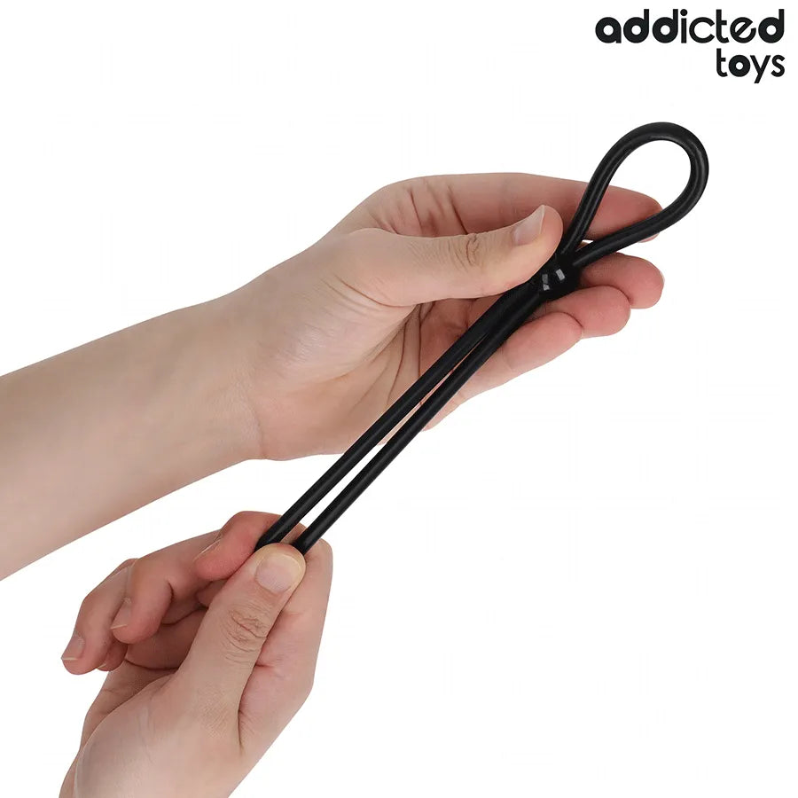 Corde en silicone noire Addicted Toys, boucle unique, flexible, tenue par une main, pour stimulation et confort.
