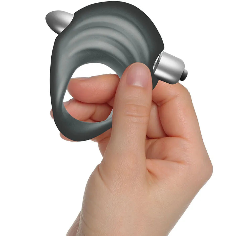 Anneau pénien vibrant noir en silicone ondulé avec balle amovible, tenu en main, sextoy étanche pour couple.