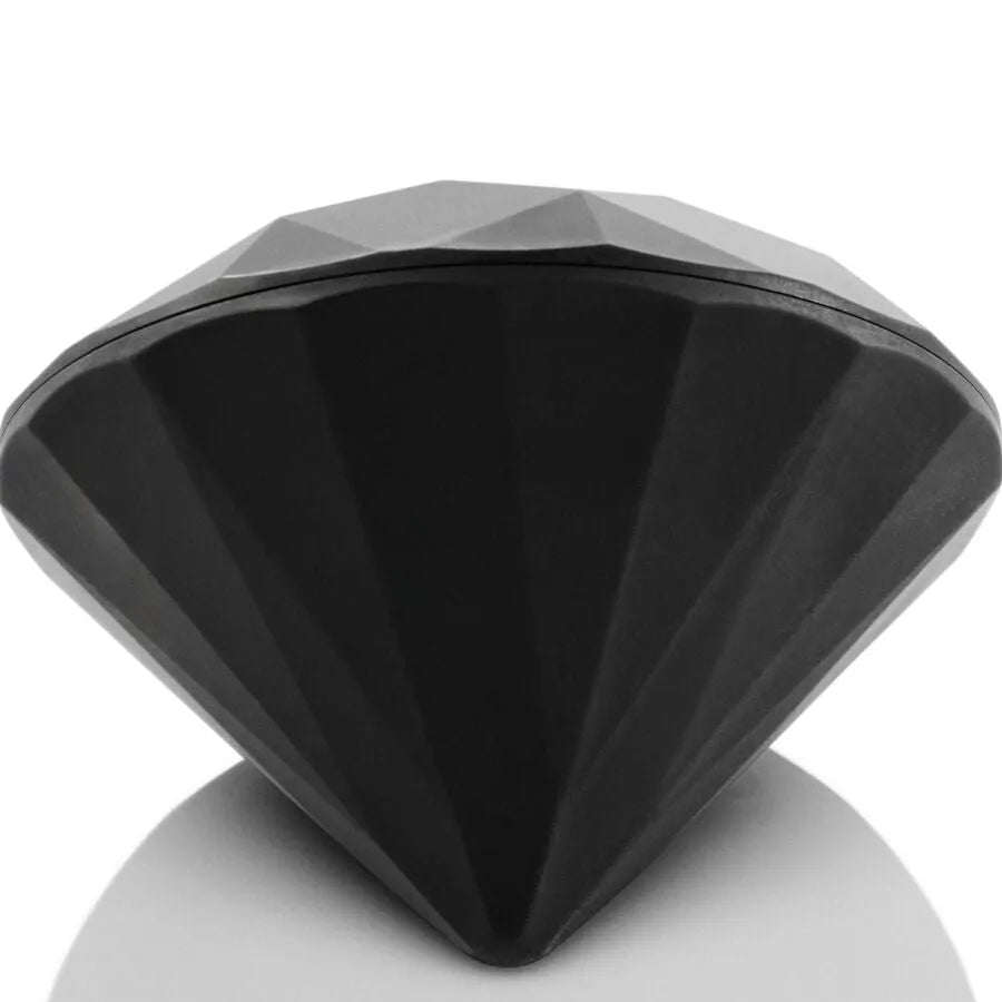 Vibrateur noir en forme de diamant, facettes géométriques, finition mate, présenté dans un écrin élégant, édition limitée.